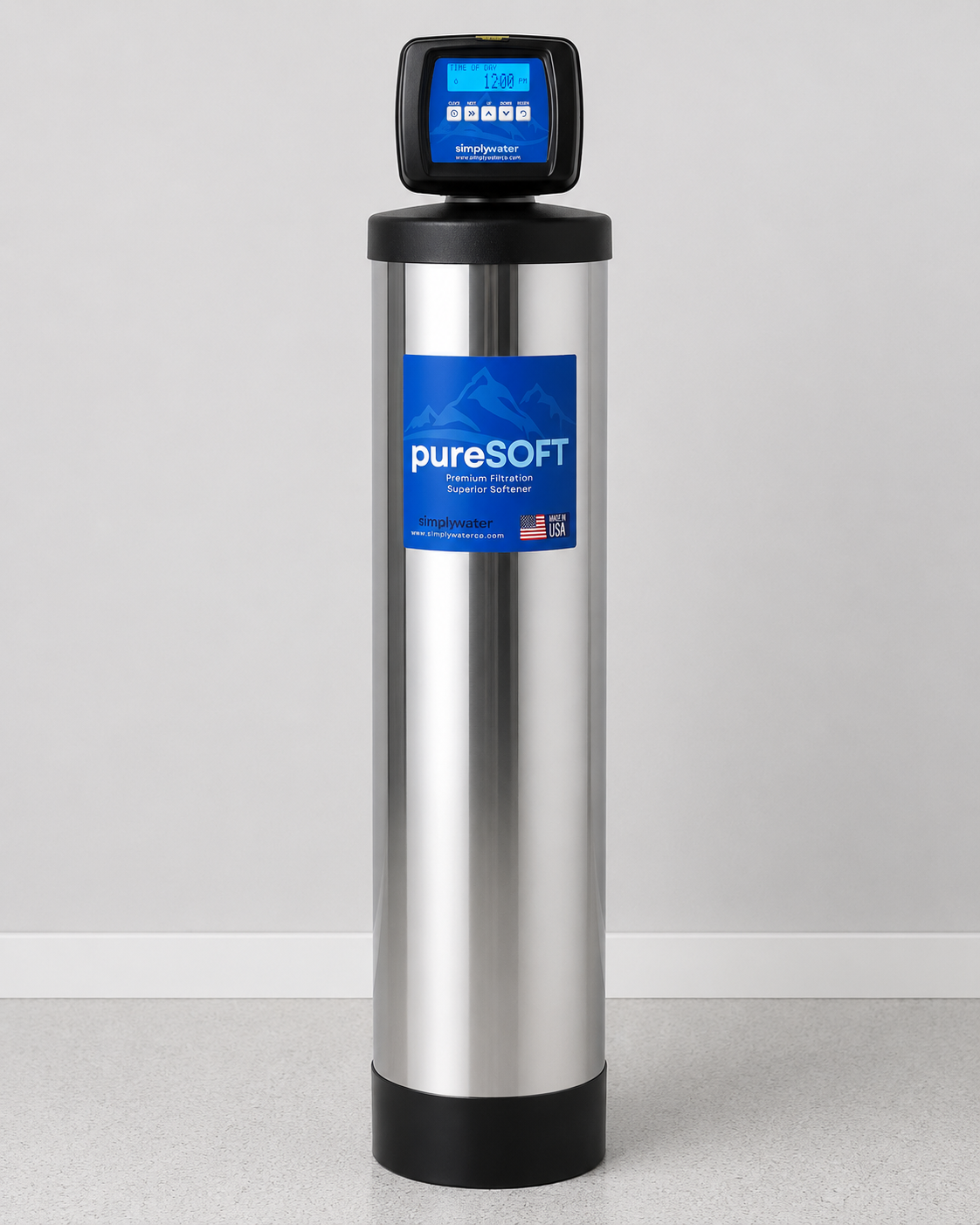 Simply Water pureSOFT water softening system, a stainless tank with a digital control head, installed in a bright home interior